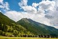 Amazing view of the typical chalets and green slopes of the Swiss Alps. Colorful summer view of village. Idyllic outdoor