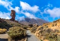 Amazing view of unique Roque Cinchado rock formation with famous Pico del Teide in the background on a sunny day, Teide National