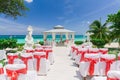 Amazing view of wedding ceremony event decorated gazebo against blue sky and ocean background Royalty Free Stock Photo