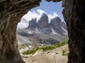 Amazing view of the wonderful 3 Cime di Lavaredo from the shelters of the First World War carved into the rock. Dolomites in Italy Royalty Free Stock Photo