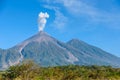 Amazing volcano El Fuego during a eruption on the left and the Acatenango volcano on the right, view from Antigua, Guatemala Royalty Free Stock Photo