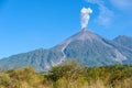 Amazing volcano El Fuego during a eruption on the left and the Acatenango volcano on the right, view from Antigua, Guatemala Royalty Free Stock Photo