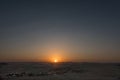 amazing warm sunset in the desert with mountains at the horizon on vacation