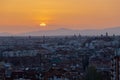 An amazing warm sunset over the skyline of Madrid and Sierra de Guadarrama from the Tio Pio parque