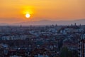 An amazing warm sunset over the skyline of Madrid and Sierra de Guadarrama from the Tio Pio parque