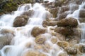 Amazing waterfall like fog around stones Royalty Free Stock Photo