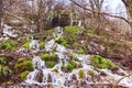 Amazing waterfall stream in forest, early spring. Nature landscape. Waterfall Siga. Homolje mountains Royalty Free Stock Photo