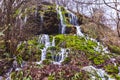 Amazing waterfall stream in forest, early spring. Nature landscape. Waterfall Siga. Homolje mountains Royalty Free Stock Photo