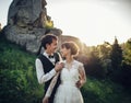 Luxury wedding couple is hugging each other in mountains