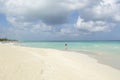 Amazing white sandy beach, tourists and Caribbean sea