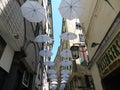 An amazing white umbrellas decoration over the city of Genova