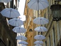 An amazing white umbrellas decoration over the city of Genova