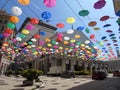 An amazing white umbrellas decoration over the city of Genova