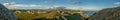 Amazing wide panoramic mountain view with the nice sky and the sea in the warm sun light in afternoon Royalty Free Stock Photo