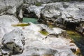 Amazing wild water in mala korita Soce valley, small pure clear turquoise flowing stream through stone gorge