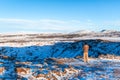 Amazing winter landscape near Kerid lake. The guy walks near the crater of the volcano Kerid in winter Royalty Free Stock Photo