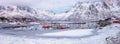 Amazing winter landscape, snowy mountains, fjord with fishing boats, Lofoten Islands. Outdoor travel background Royalty Free Stock Photo