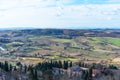 Picturesque winter landscape view of Tuscany with stone houses, colorful hills, fields and vineyards in Italy Royalty Free Stock Photo