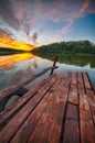 Amazing Wooden dock, pier, on a lake in the evening Royalty Free Stock Photo