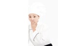 Amazing young woman chef looking with blank board