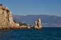 Amazingly beautiful Rock Sail stands in the Black Sea near the Crimean city of Yalta. The blue of the sea, sky and mountains as a Royalty Free Stock Photo