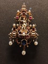 Amazingly detailed brooch with rubies and pearls and figure in gold mount