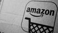 Amazon box detail with logo, smile and stylized shopping cart in black and white