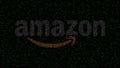 Amazon.com logo made of flashing hexadecimal symbols on computer screen. Editorial 3D rendering