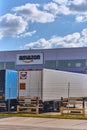 Amazon distribution center with rental trailer parked in front of the modern warehouse, logistics hub and e-commerce supply chain Royalty Free Stock Photo