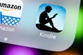 Amazon Kindle application icon on Apple iPhone X screen close-up. Amazon Kindle app icon. Amazon kindle application. Social media Royalty Free Stock Photo