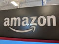 Amazon logo on black shiny wall in Honolulu Best Buy store Royalty Free Stock Photo