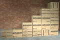 AMAZON logo on many boxes composing a rising bar chart. Editorial business success concept. 3D rendering