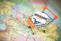 Amazon logo in shopping trolley on map