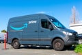 Amazon Prime delivery van safely parked outdoor while making deliveries products ordered online on Amazon.com to company customers Royalty Free Stock Photo
