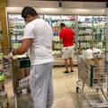 Amazon Prime Fresh employees shopping at a Whole Foods grocery store