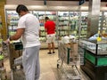 Amazon Prime Fresh employees shopping at a Whole Foods grocery store