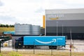 An Amazon Prime truck arriving at an Amazon warehouse