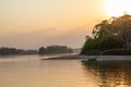 Amazon rainforest sunset during a boat trip with a reflection of the trees in the water. Puerto Francisco de Orellana. Ecuador. Royalty Free Stock Photo