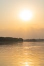 Amazon rainforest sunset during a boat trip with a reflection of the trees in the water. Puerto Francisco de Orellana. Ecuador. Royalty Free Stock Photo