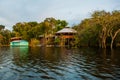 Amazon river, Manaus, Amazonas, Brazil: Amazon landscape with beautiful views. Wooden houses on an island on the Amazon river in