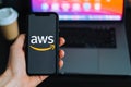 Amazon Web Services logo on the smartphone screen