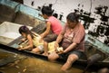 Unidentified family work with tapioca in amazon river shore