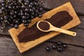 Acai berry powder in spoon - Euterpe oleracea