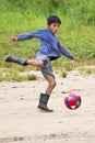 Amazonian Quechua boy playing soccer