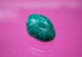 An amazonite as tumbled gemstone and healing stone