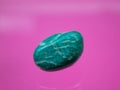 An amazonite as tumbled gemstone and healing stone