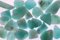 Amazonite jewel heap texture on light surface Royalty Free Stock Photo