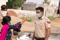 Ambala City, Haryana/India -04/30/2020 Health workers checking body temperature of police during Routine Checkup to avoid covid i