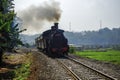Ambarawa, May 2020, Indonesia. Historic steam engine with heavy dark grey smoke Royalty Free Stock Photo