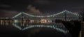 Ambassador Bridge glows at night over the Detroit River